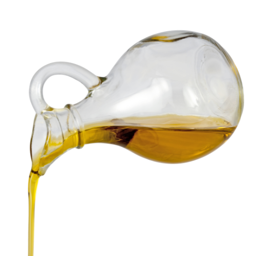 Olive oil being poured from a glass container